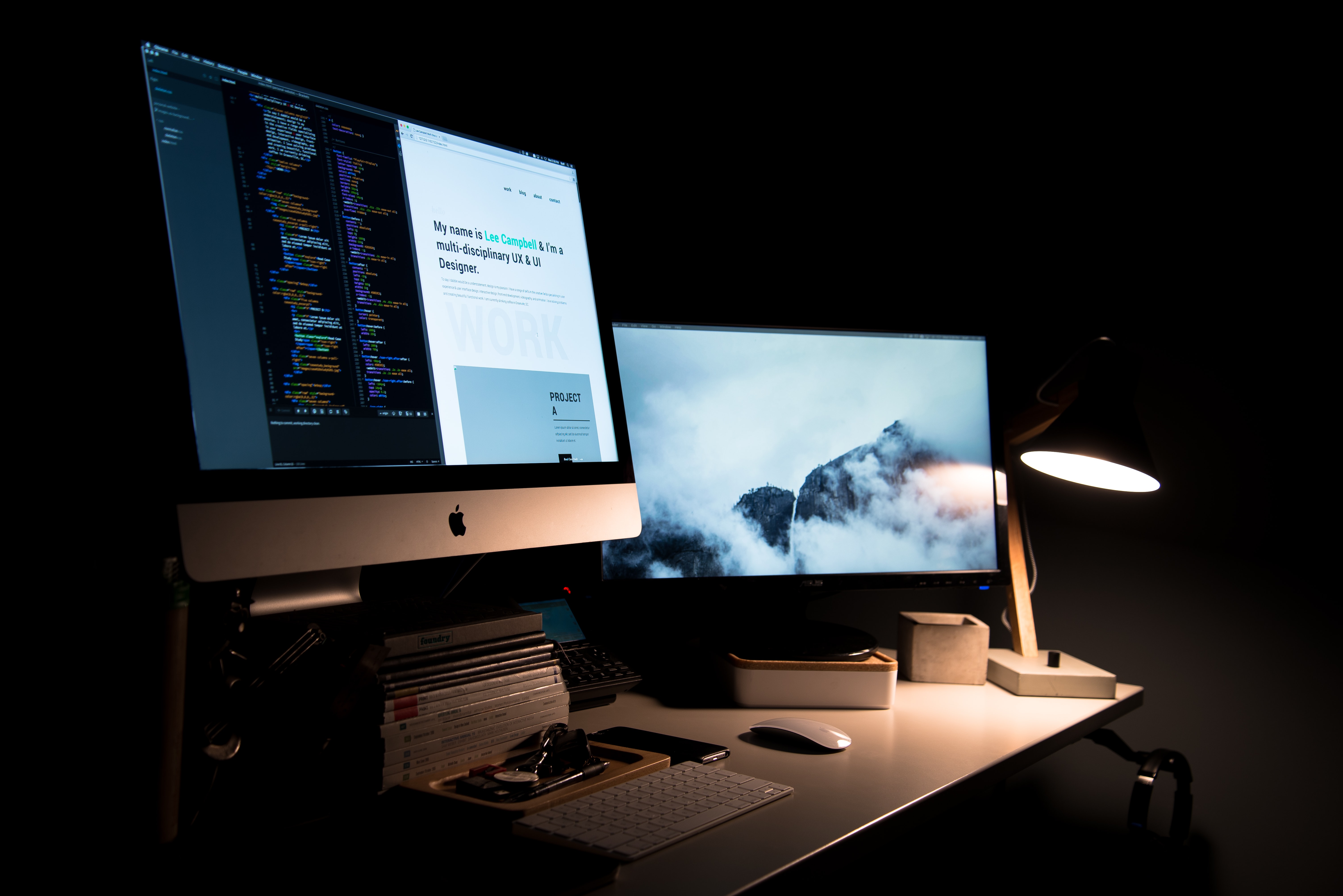 Computer setup on a desk in a low lit room