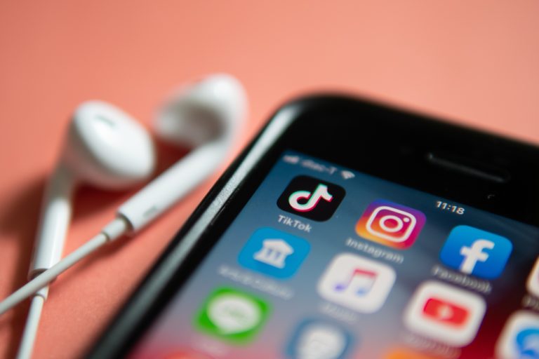 A closeup of social media platforms on a phone.
